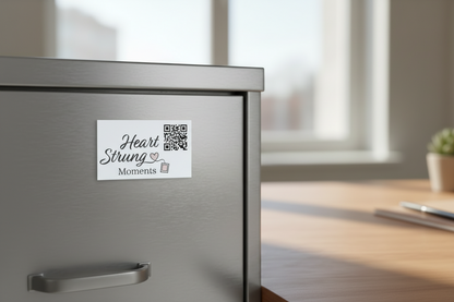 Metal file cabinet with a magnet for 'Heart Strung Moments' on a blurred indoor background