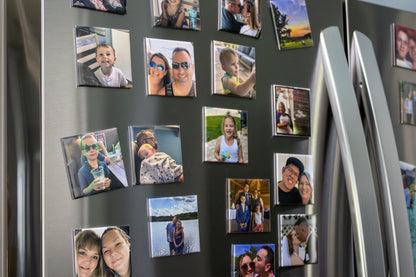 Fridge with various family photos attached as magnets